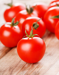 Cherry tomatoes on the wood background