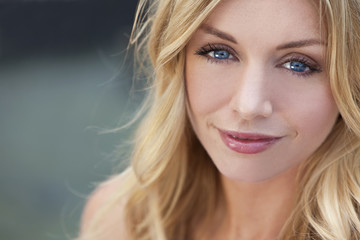 Naklejka premium Naturally Beautiful Blond Woman With Blue Eyes