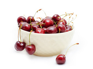 sweet cherries in the white bowl