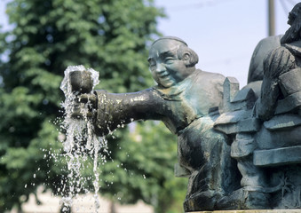 Monk at a fountain