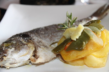 Mediterranean dorade oven baked with salt and potatoes