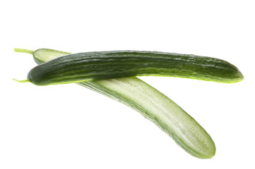 Cutting cucumber on white