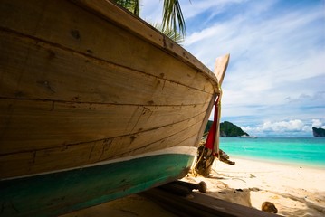 Old Thai boat at the beach. Phi Phi island. Thailand