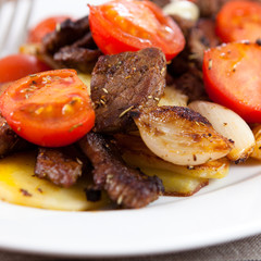 Close-up of beef with roasted vegetables