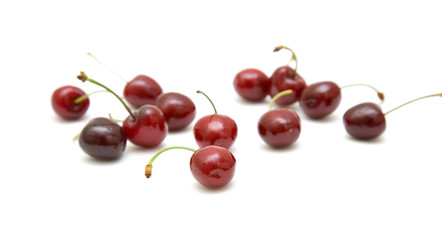 handful of cherries on white background