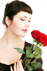 Young Sexy sensual woman with red roses