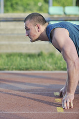 Obraz premium young athlete on start