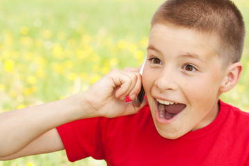 Fototapeta premium The boy speaks by phone