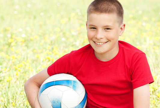 The boy with ball in hands