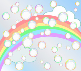 Soap bubbles against the blue sky, rainbow and clouds