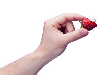 Obraz premium Strawberry with cream in hand