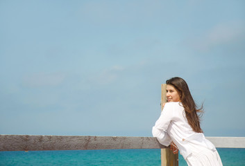 Fototapeta na wymiar young romantic girl on sea background