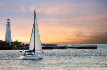 sailboat leaving marina