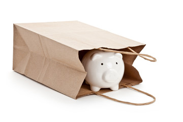 Brown paper shopping bag and Piggy Bank