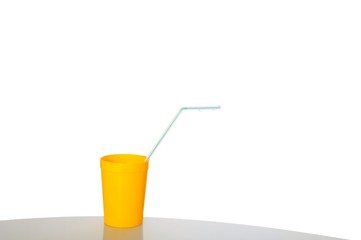 Yellow  cup with drinking straw