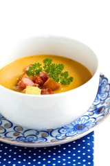 vegetable puree soup with rusk, bacon and parsley