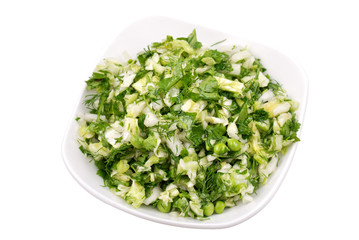 Fresh salad from vegetables and greens on a plate