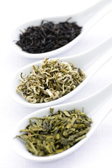 Assortment of dry tea leaves in spoons