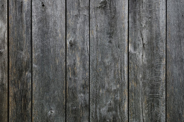 Black painted weathered wooden fence texture