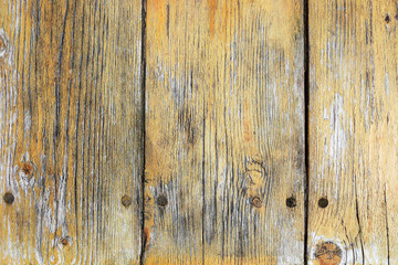 Fototapeta na wymiar Yellow painted scratched and threadbare wooden plank texture