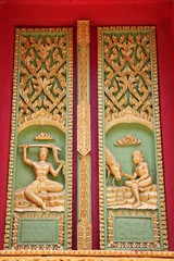 Fototapeta na wymiar buddhist art on door of temple, Wat Ku Ka Singh, Roi-Et