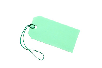 Blank green tag tied with string on white.