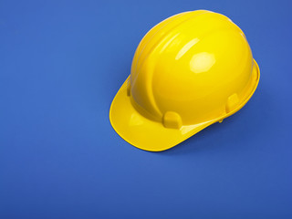 Fototapeta premium Yellow Hardhat On Blue