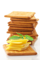 Crackers with cheese and basil