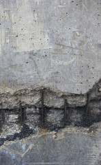 damaged worn dirty fortified concrete with rusty metal showing