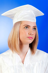 Happy graduate against colourful background