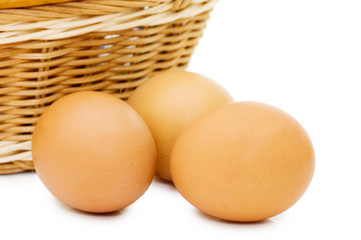 Eggs in a basket on a white background