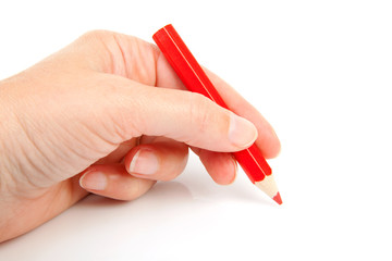 hand with red pencil over white background