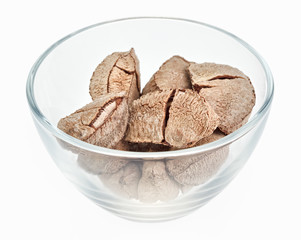 Brazil nuts in a glass bowl isolated on white