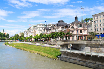 Elegant buildings line the Salzach River, downtown Salzburg