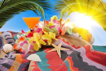 orange cocktail,Hawaiian lei and bright sunshine