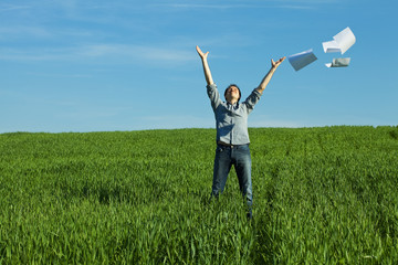 man throws the paper in the field