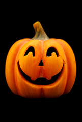 Orange Halloween pumpkin isolated on black.