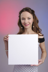Naklejka premium Beautiful woman holding blank sign