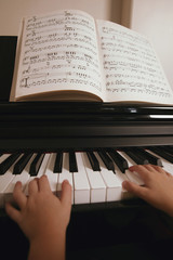 Child Plays The Piano