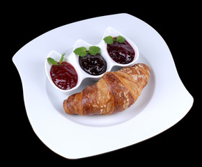 Croissant on plate with 3 color jam