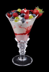 Fruit desert in wineglass on black