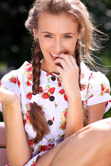 Obraz premium Portrait of the beautiful girl with a strawberry