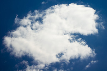Naklejka na ściany i meble Single cloud in the blue sky