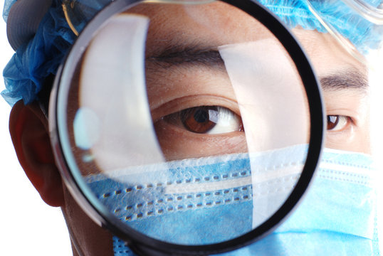 doctor holding magnifier