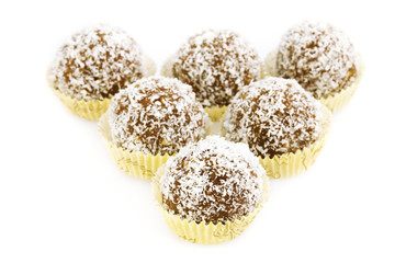 cake topped with coconut flakes isolated on white