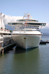 A cruise ship anchored in the vancouver harbor.