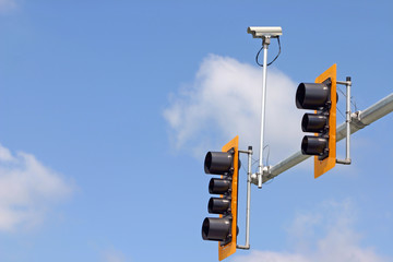 Secure camera with traffic light and sign.