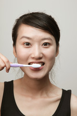 attractive young lady with a tooth brush