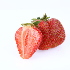 Strawberries on white background (a whole one and a half)