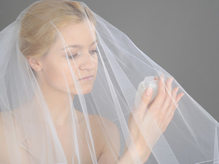 Beautiful young bride in white veil